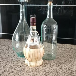 2 Ginormous wine bottles and one Chianti bottle